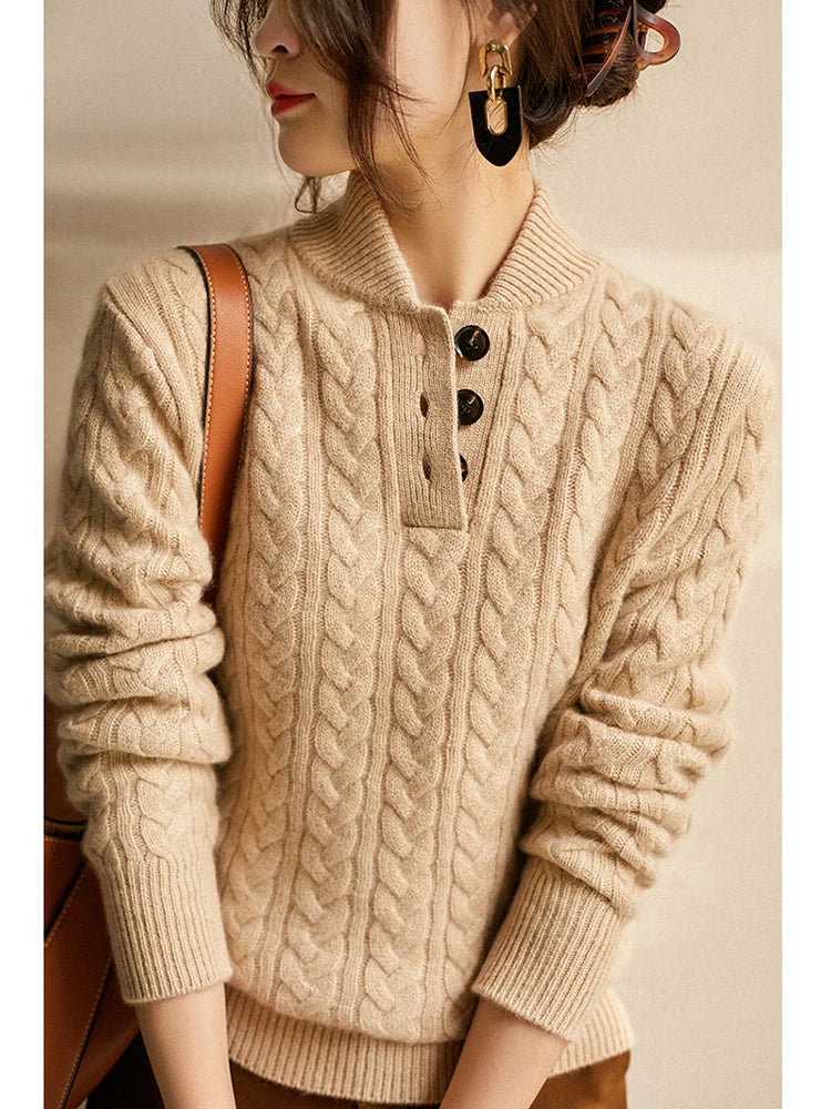 Front view of stand collar, button placket and cable-knit sleeves