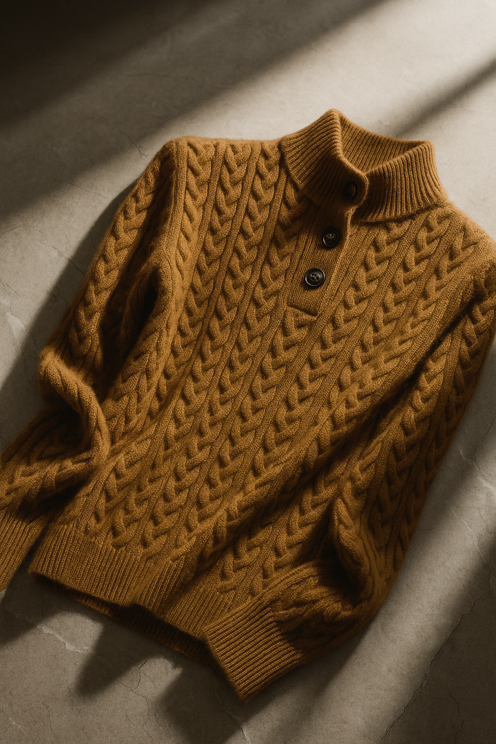 Flat lay view of stand collar, button placket and cable-knit bodice