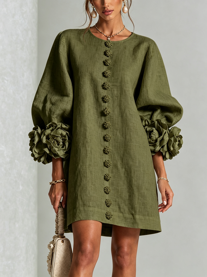Front view of round neckline, button placket and rose-shaped cuffs, olive green