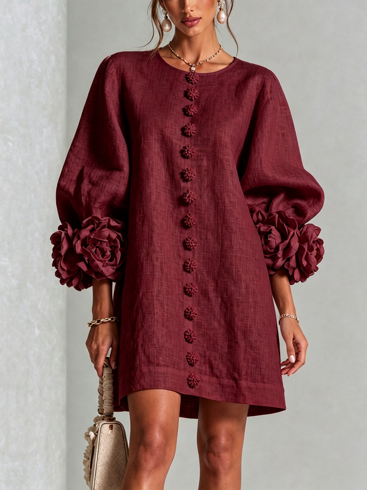 Front view of round neckline, button placket and rose-shaped cuffs, burgundy