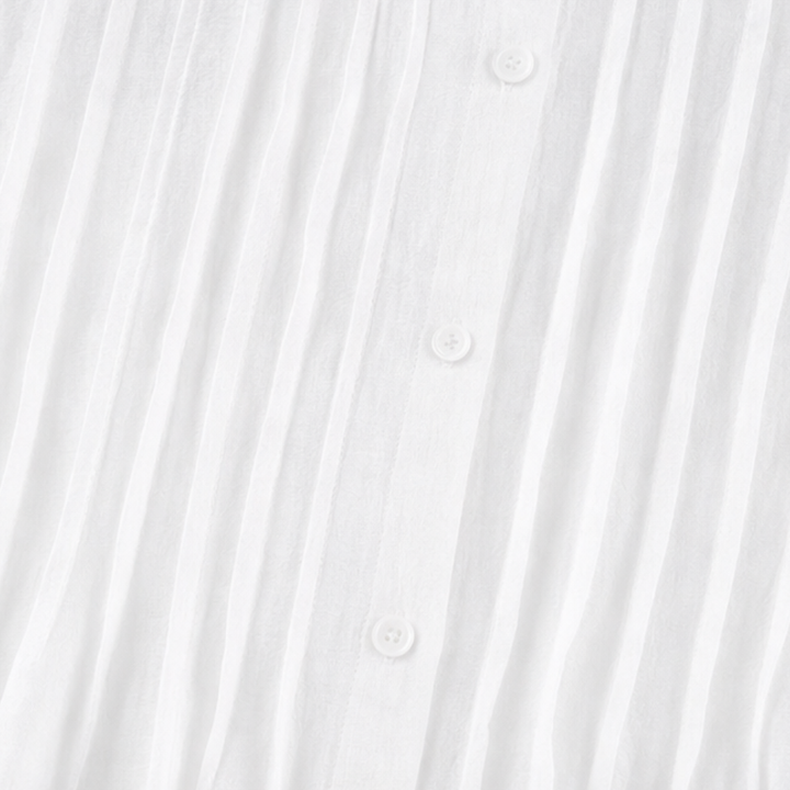 Detail view of pintuck bodice and buttons