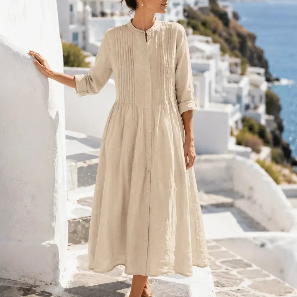 Side view showing pintuck bodice, button placket and banded cuffs, khaki