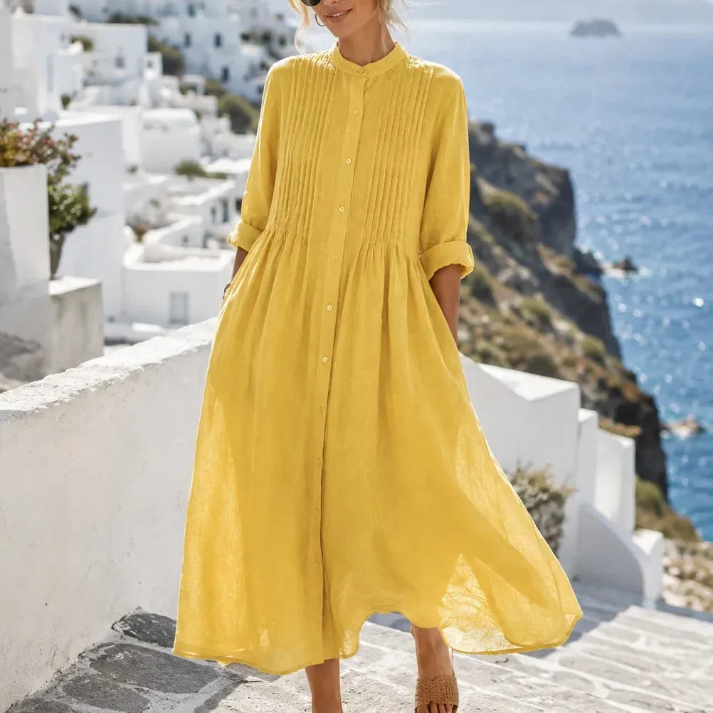 Front view showing pintuck bodice, button front and gathered skirt, yellow