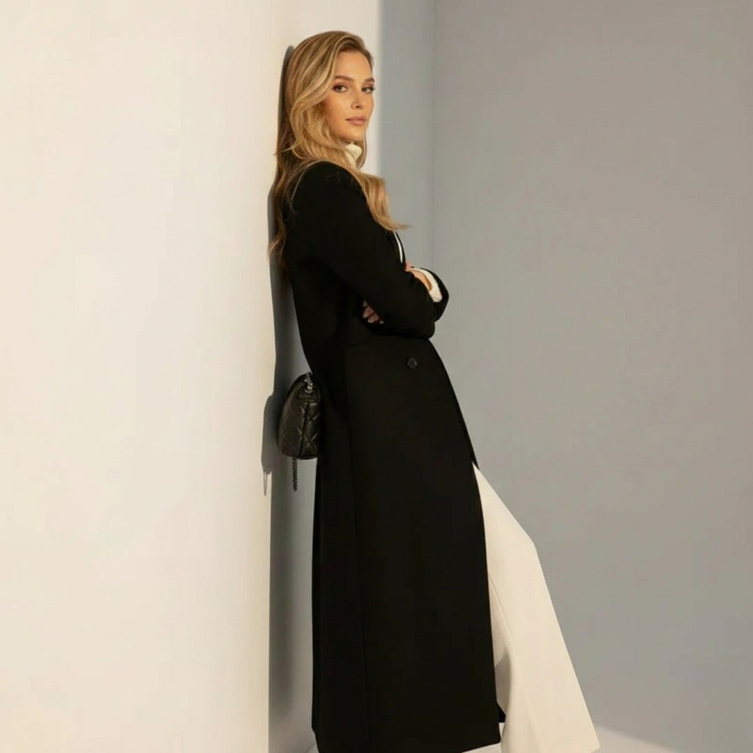 Side view showing long sleeves and floor-length hem