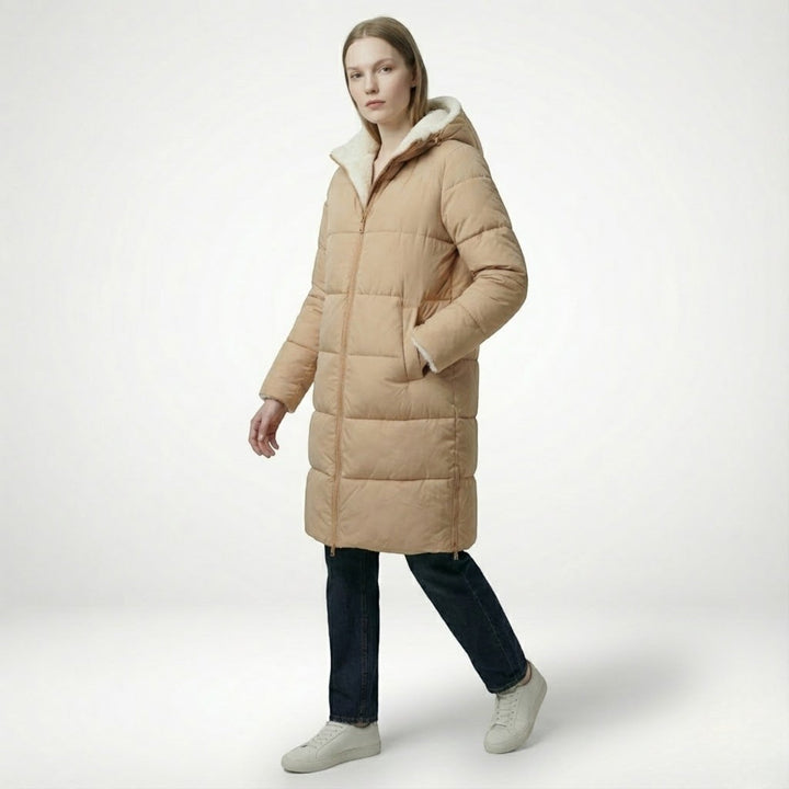Side view showing hood, quilted body and side pocket, beige