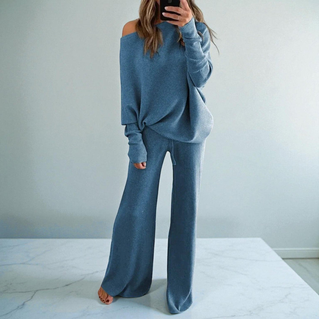 Front view showing boat neckline, banded cuffs and wide legs, blue