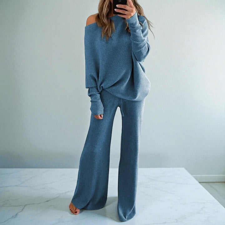 Front view showing boat neckline, banded cuffs and wide legs, blue
