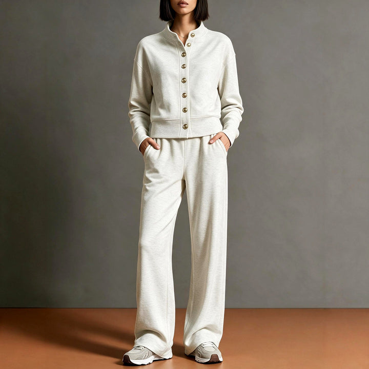 Front view showing stand collar, button placket and wide leg trousers, beige