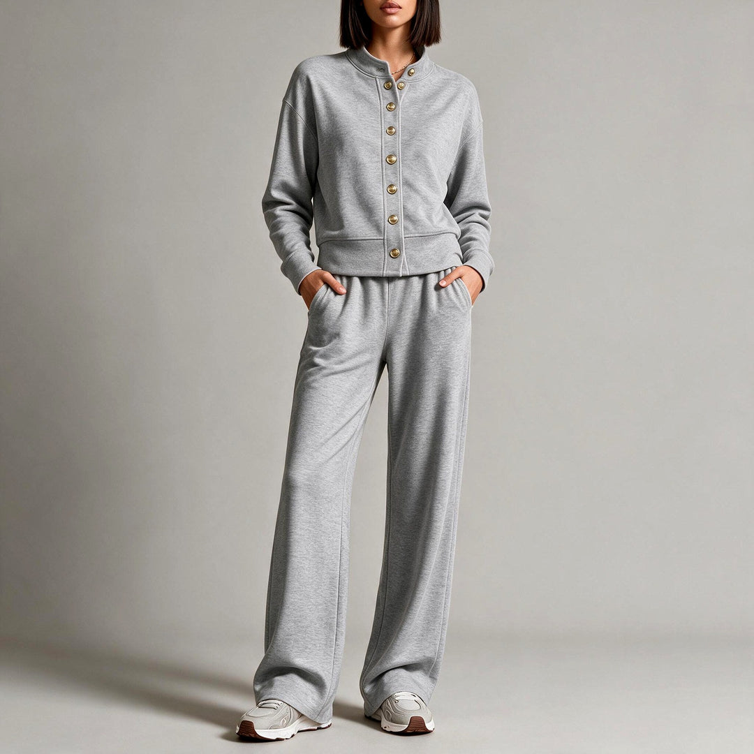 Front view showing stand collar, button placket and wide legs, dark grey