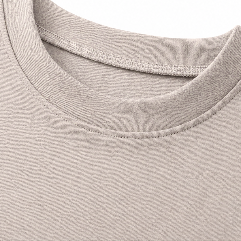 Detail view of round neckline and stitched edging