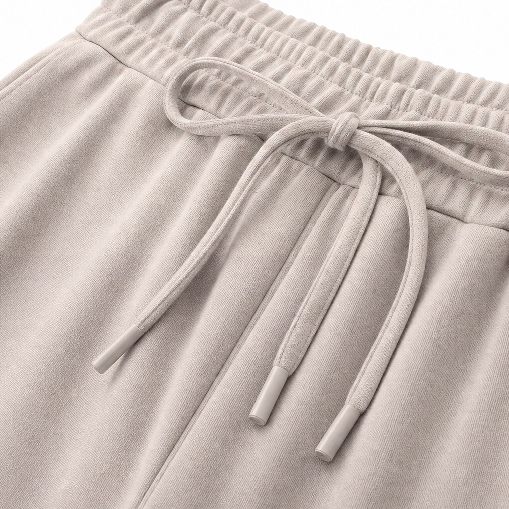 Detail view of drawstring tie at the banded waist