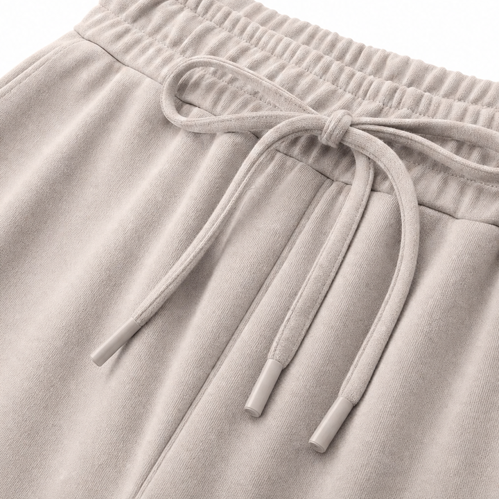 Detail view of drawstring tie at the banded waist