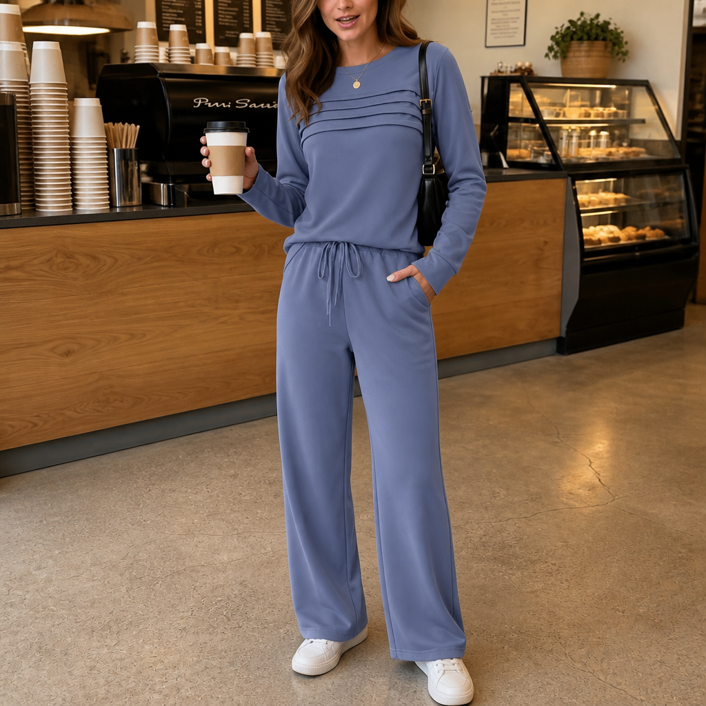 Front view with pleated bodice, long sleeves, drawstring waist and side pocket, blue