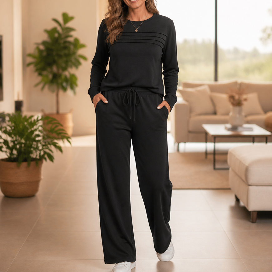 Front view with pleated bodice, side pockets and wide legs, black