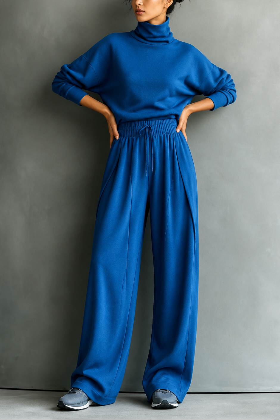 Front view of turtleneck top with long sleeves, banded waist and wide-leg trousers, blue