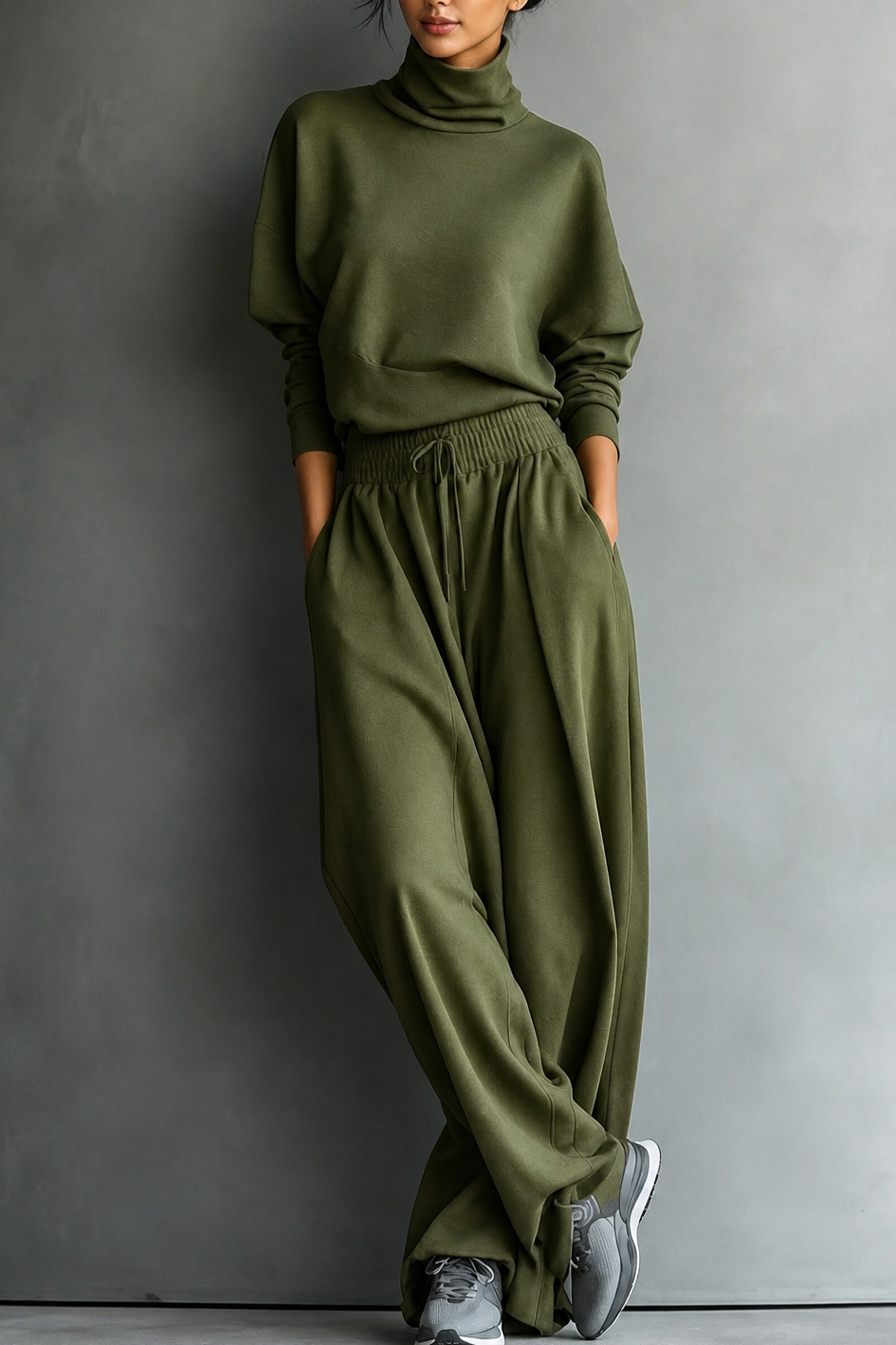 Front view of turtleneck top with side pockets and wide-leg trousers, olive green