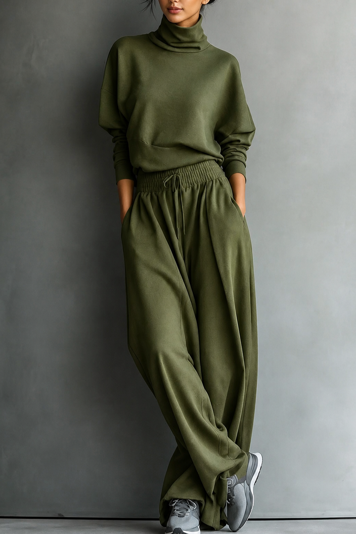Front view of turtleneck top with side pockets and wide-leg trousers, olive green