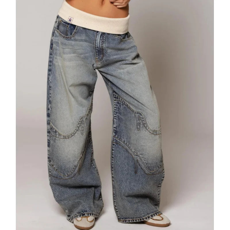 Front view of wide leg jeans with banded waist and front closure, light blue