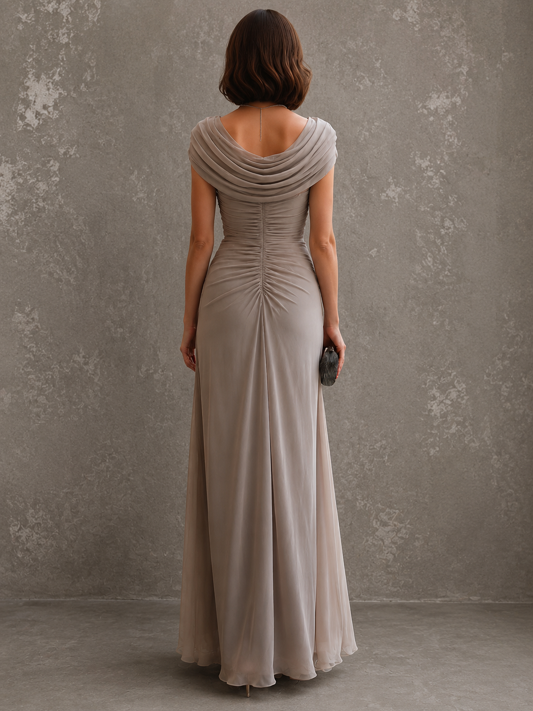 Back view of draped back neckline, ruched back bodice and floor-length skirt