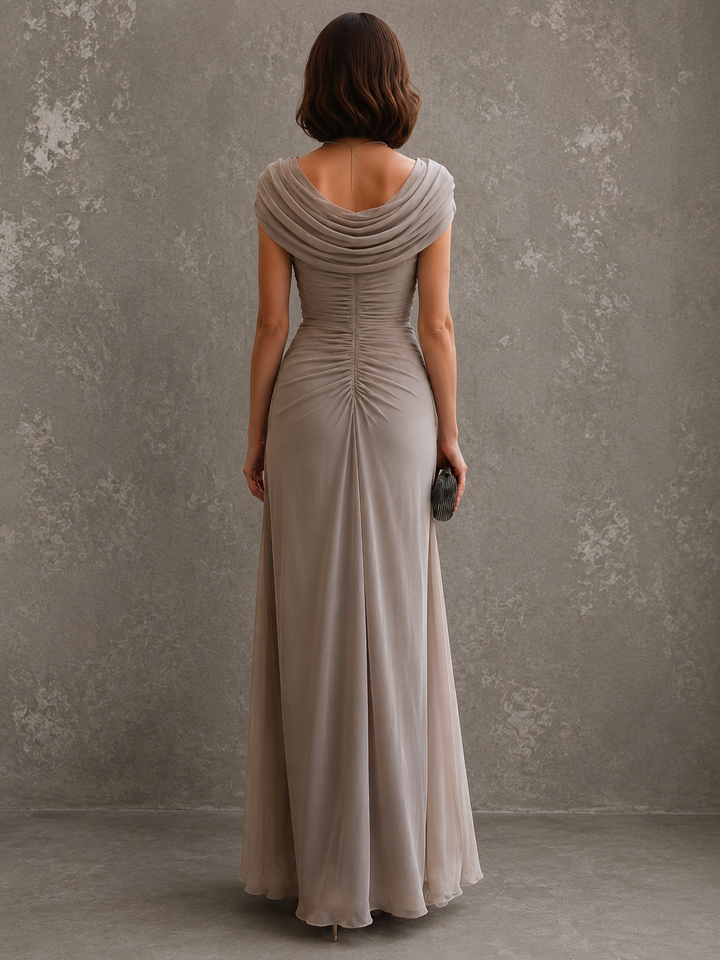 Back view of draped back neckline, ruched back bodice and floor-length skirt