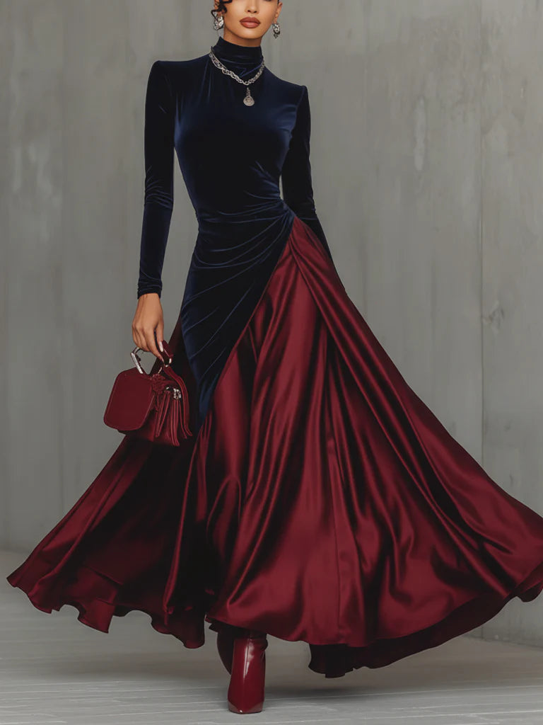 Front view showing stand collar, long sleeves and wrap panel with floor-length skirt, blue