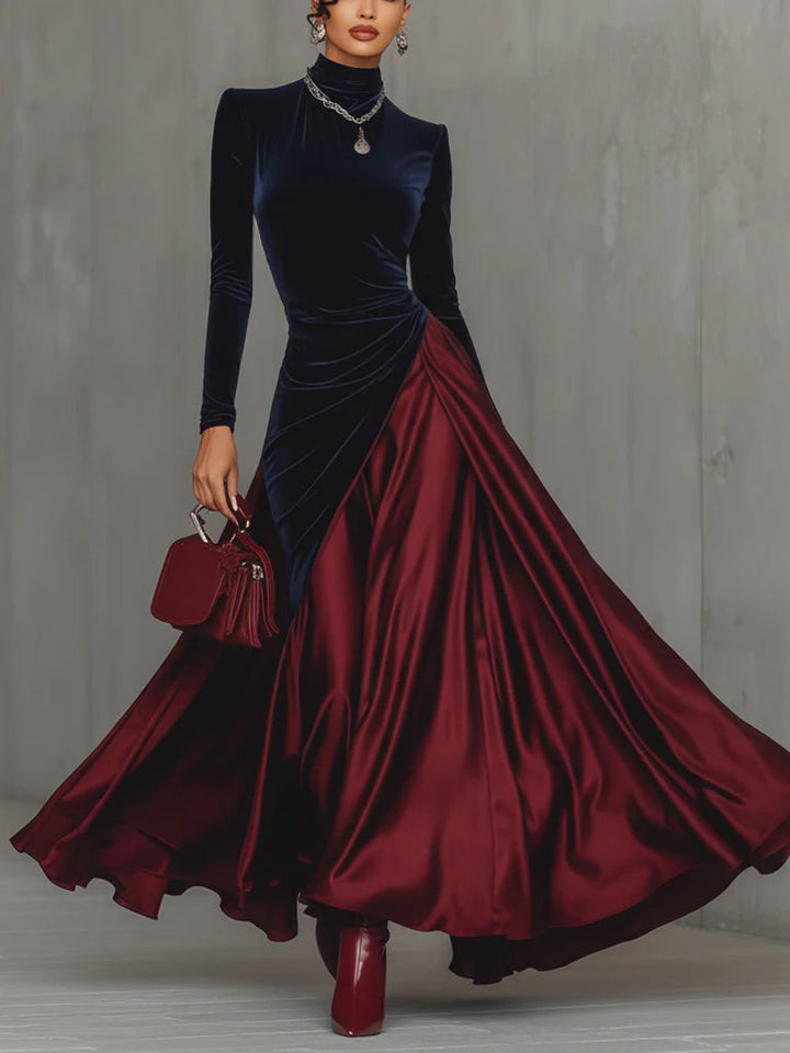 Front view showing stand collar, long sleeves and wrap panel with floor-length skirt, blue