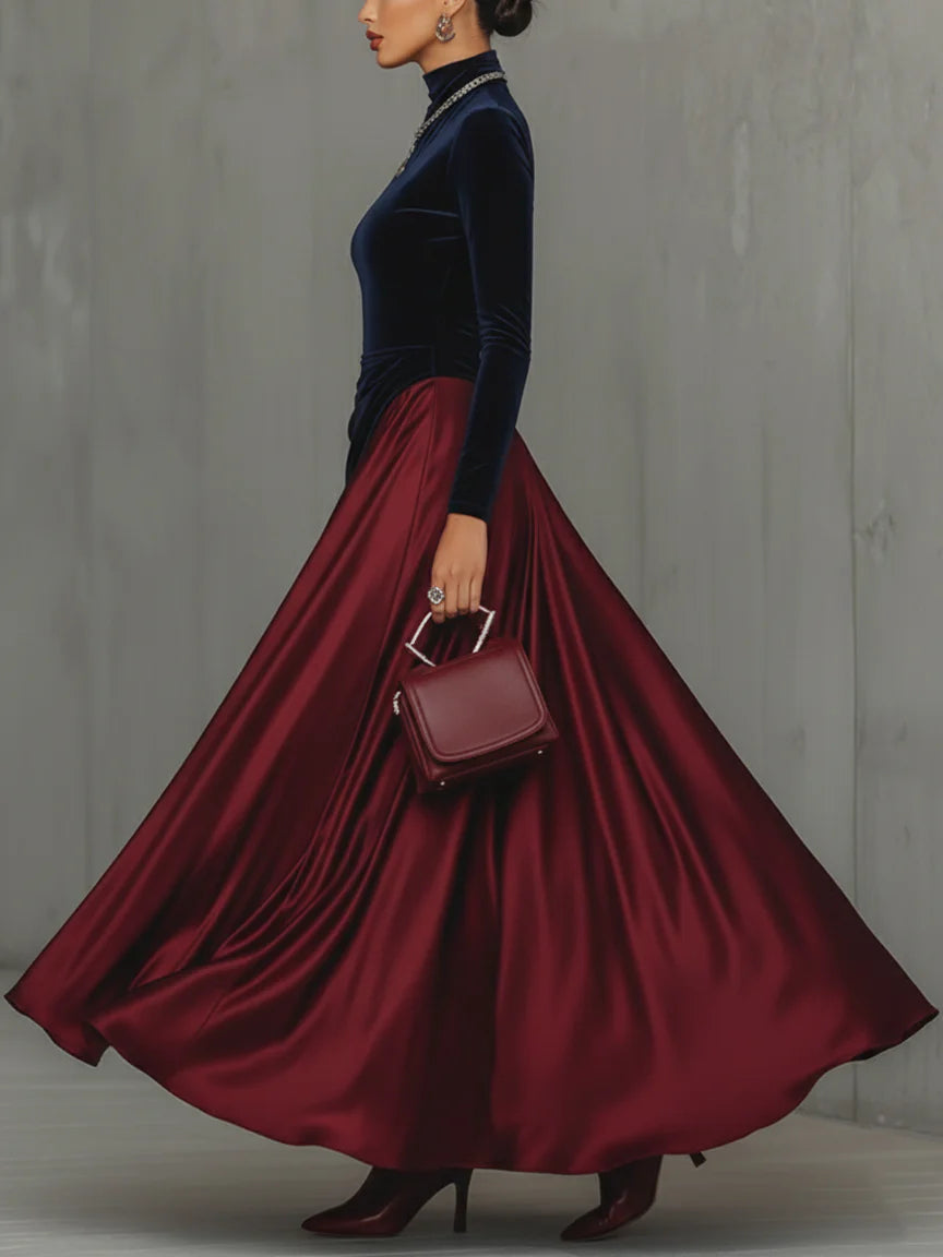 Side view showing stand collar, long sleeves and floor-length skirt