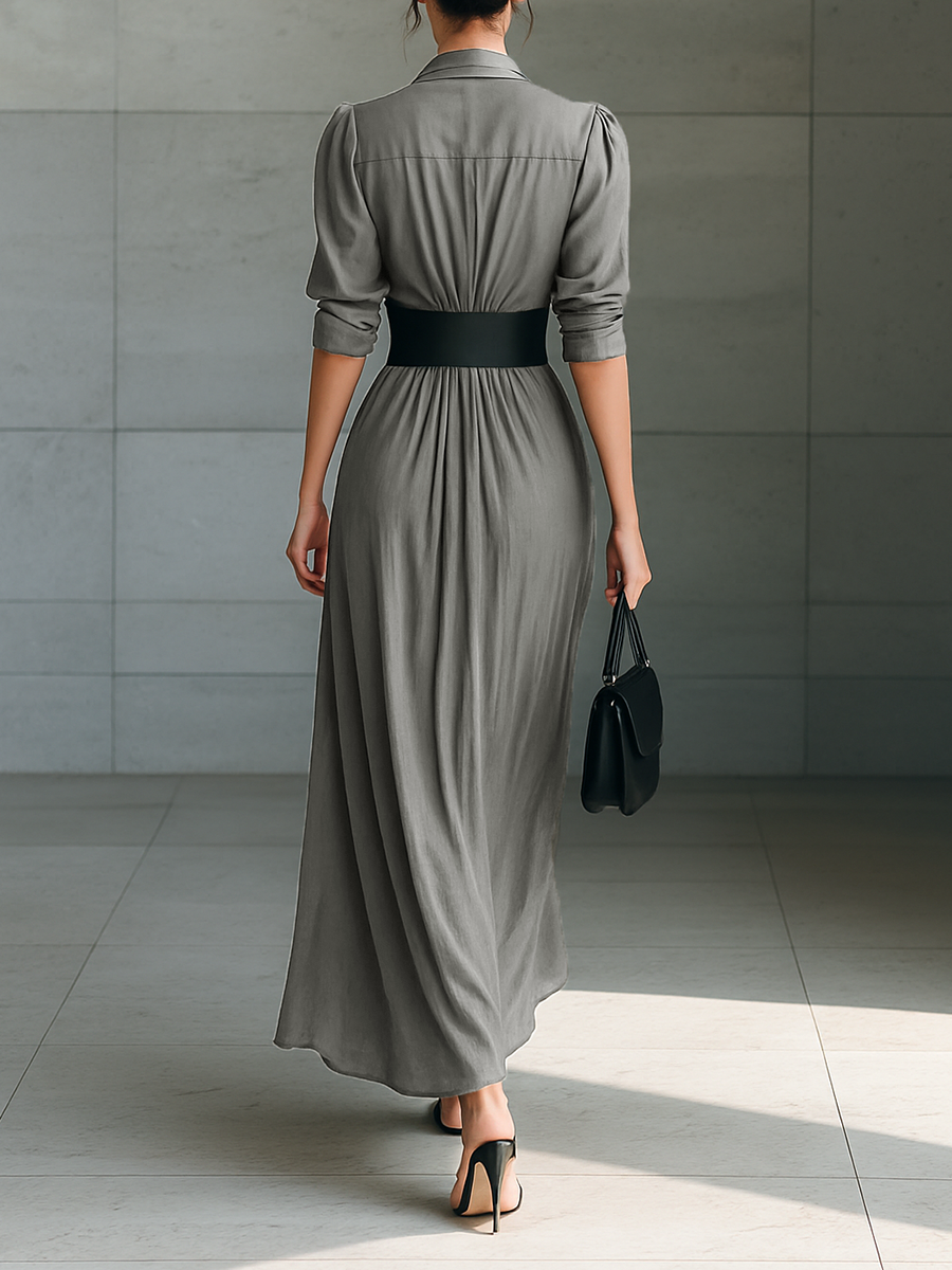 Back view of maxi dress with collar, long sleeves, banded waist and pleated skirt
