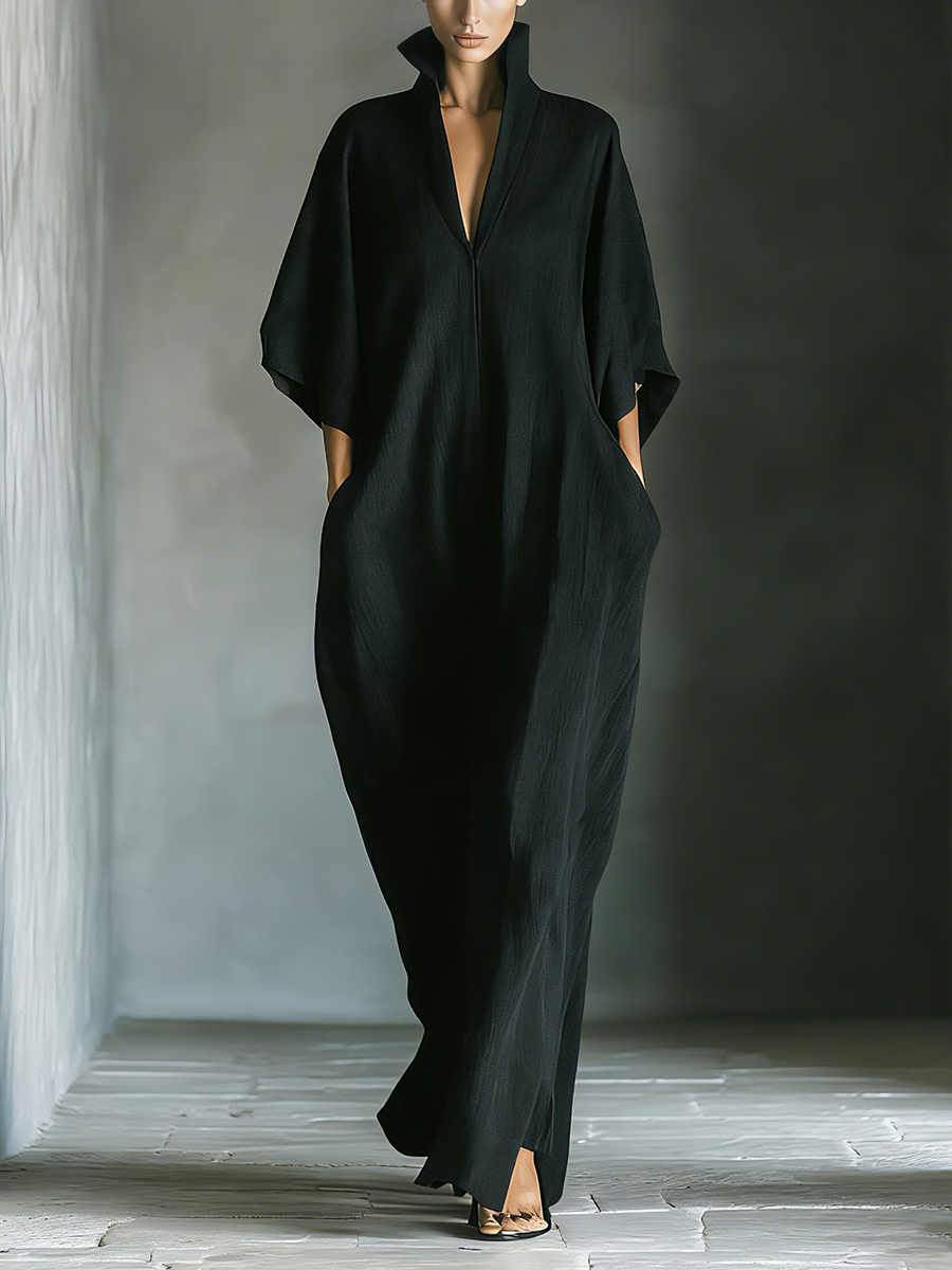 Front view of stand collar, v-neckline, wide kimono sleeves and side pockets, black