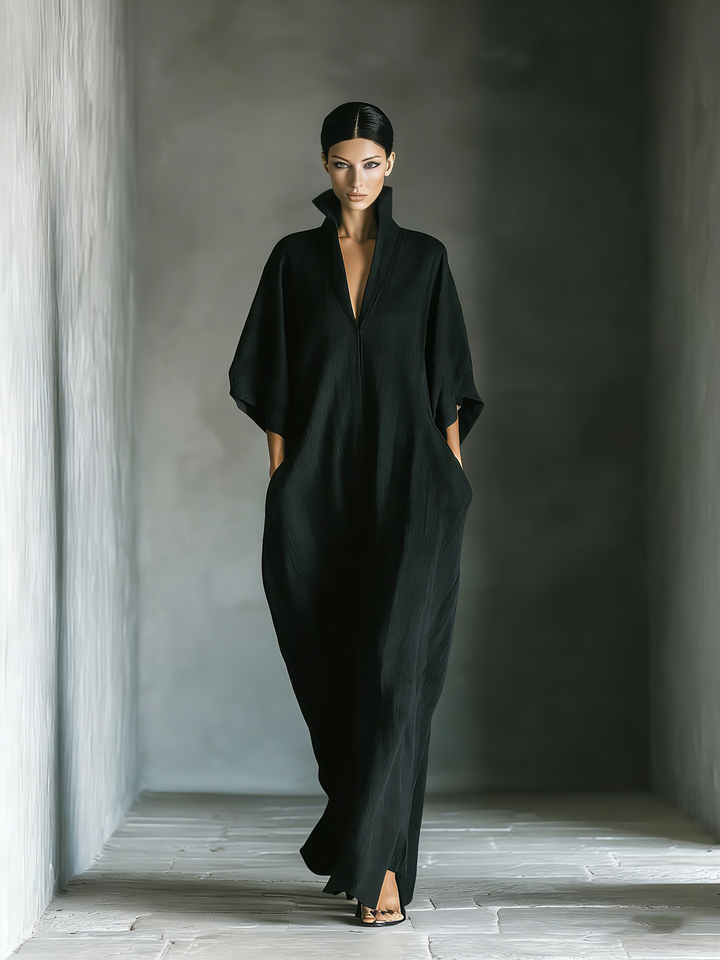 Front view of stand collar, v-neckline, kimono sleeves and side pockets