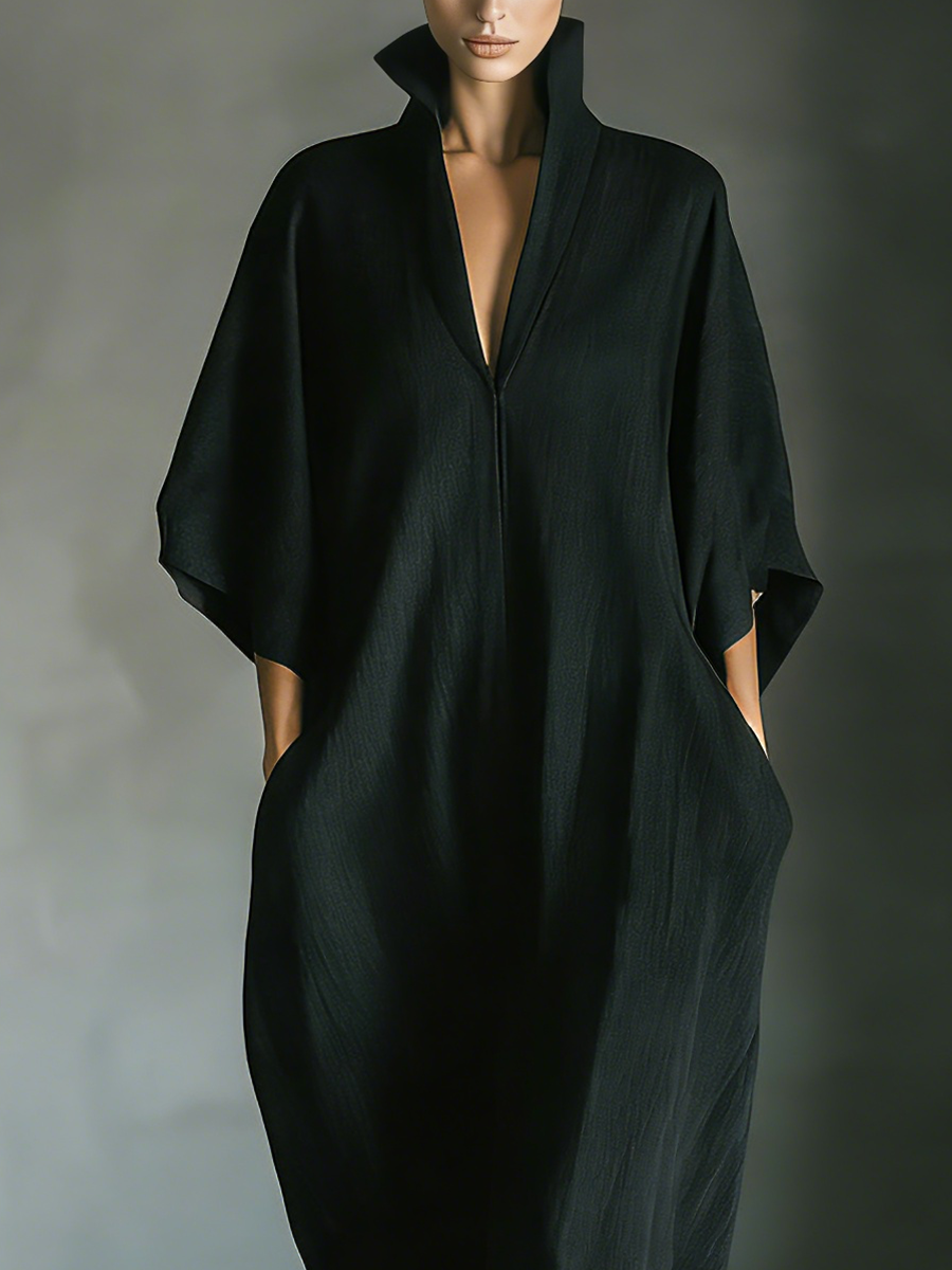 Detail view of stand collar, v-neckline and side pockets