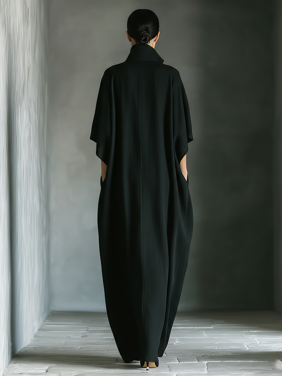 Back view of stand collar, kimono sleeves and side pockets