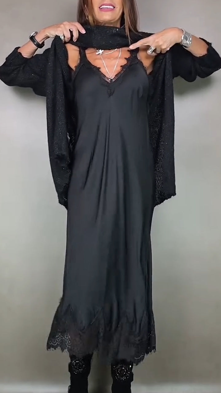 Detail view of v-neckline with lace edging on slip dress with jumper lifted