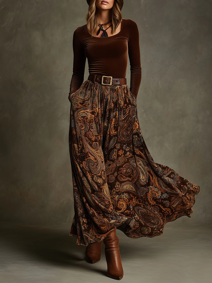 Front view of top with round neckline, long sleeves, belted waist and floor-length skirt, brown