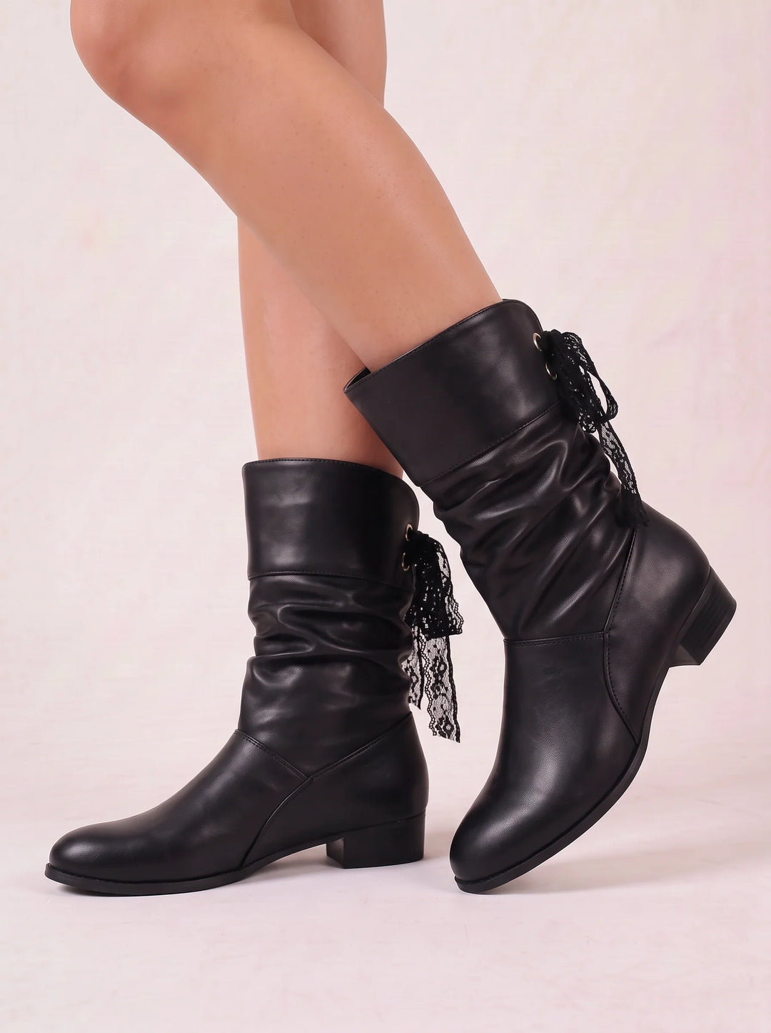 Side view showing ruched shaft and bow tie back lacing, black
