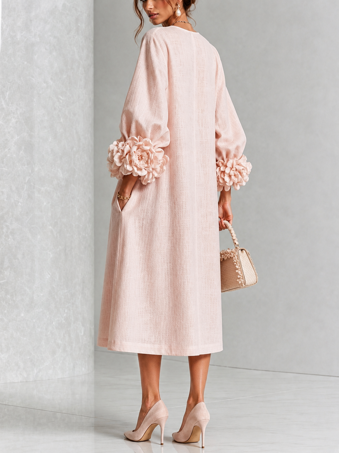Back view showing the back of the dress, floral cuffs and side pocket