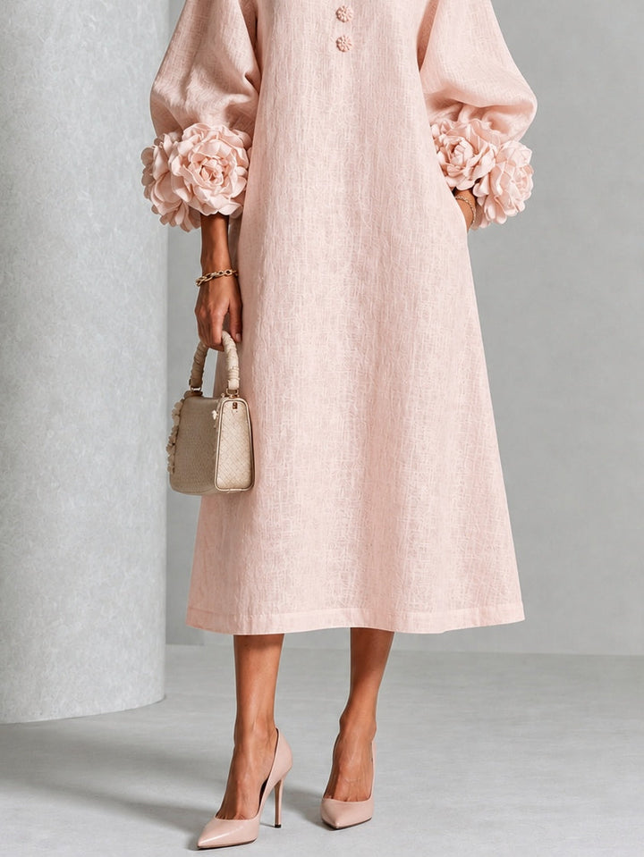 Front view showing floral cuffs, button placket and mid-calf hem