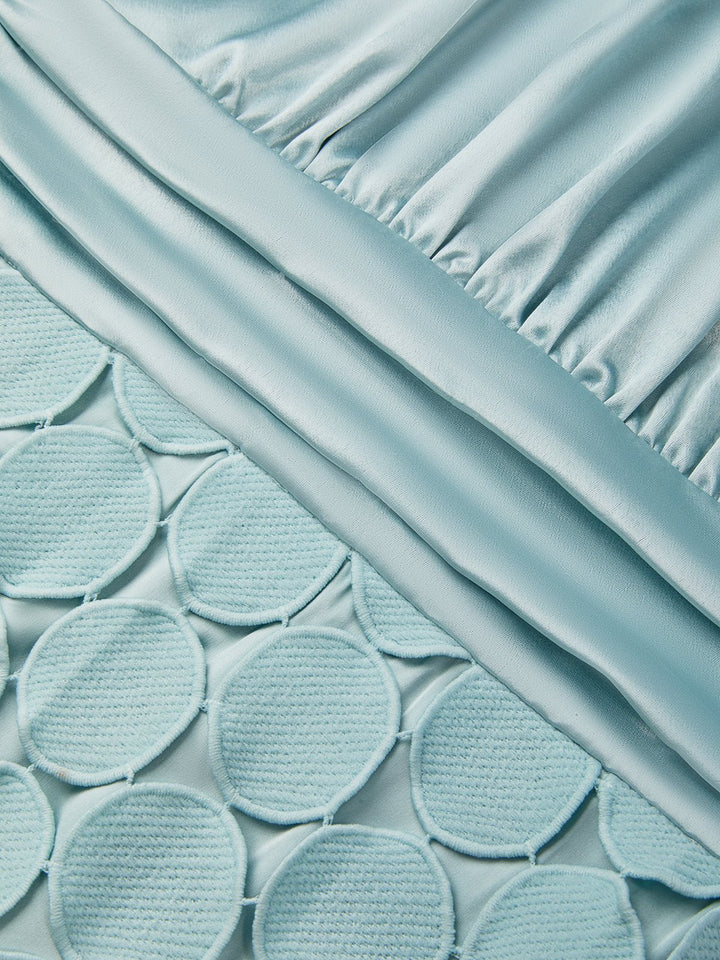 Detail view of ruching and circle paillettes