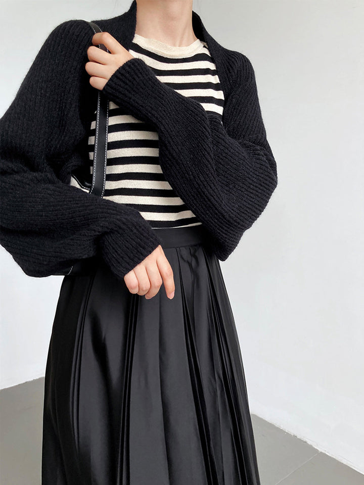 Front view showing long sleeves and ribbed cuffs, black