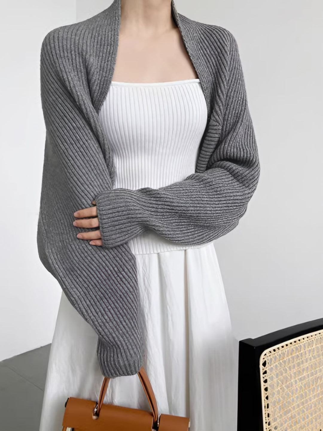 Front view showing open-front neckline and ribbed cuffs, grey
