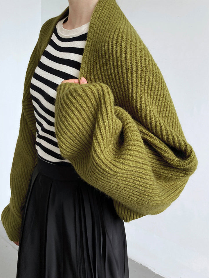 Side view showing long sleeves and ribbed cuffs