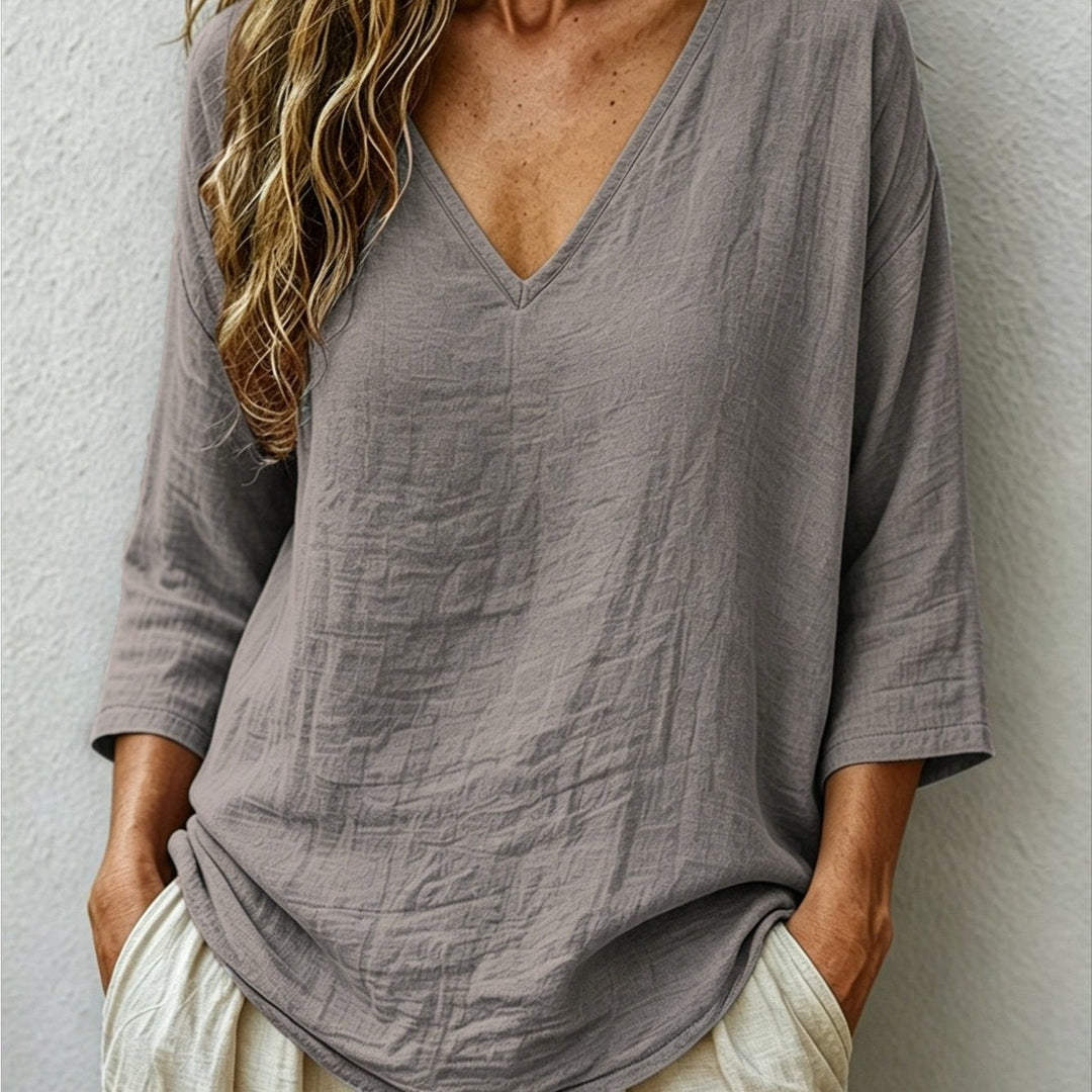 Front view showing v-neckline and dropped shoulder seams, grey