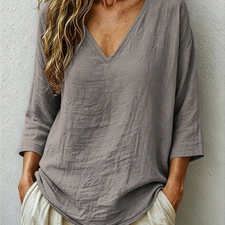 Front view showing v-neckline and dropped shoulder seams, grey