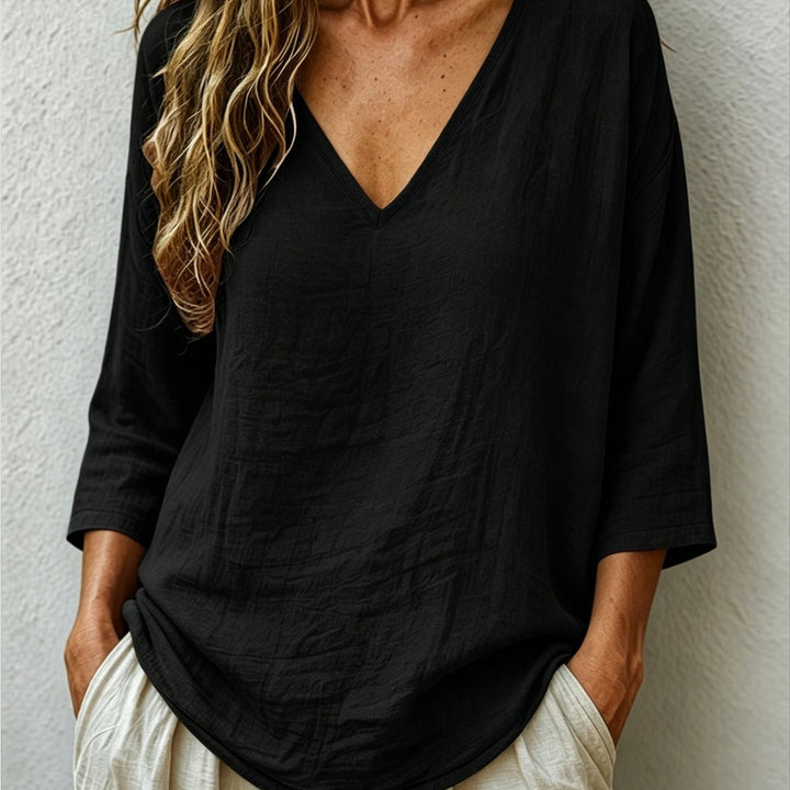 Front view showing v-neckline and three-quarter sleeves, black