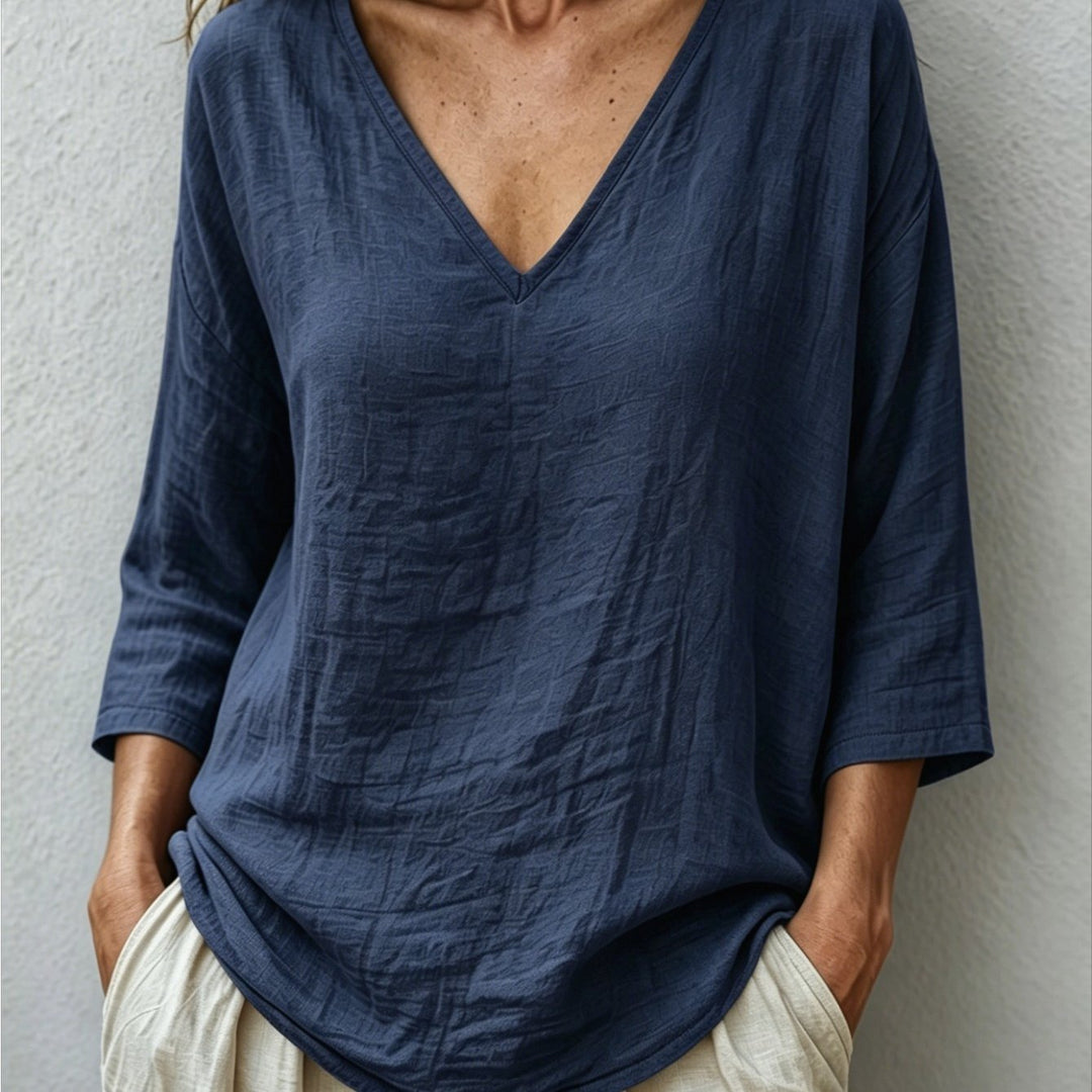 Front view showing v-neckline and dropped shoulder seams, navy color