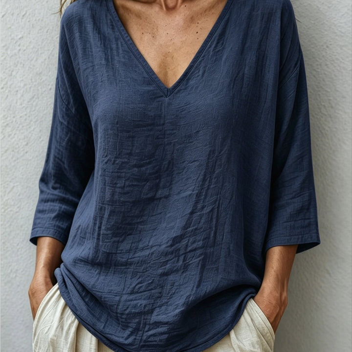 Front view showing v-neckline and dropped shoulder seams, navy color
