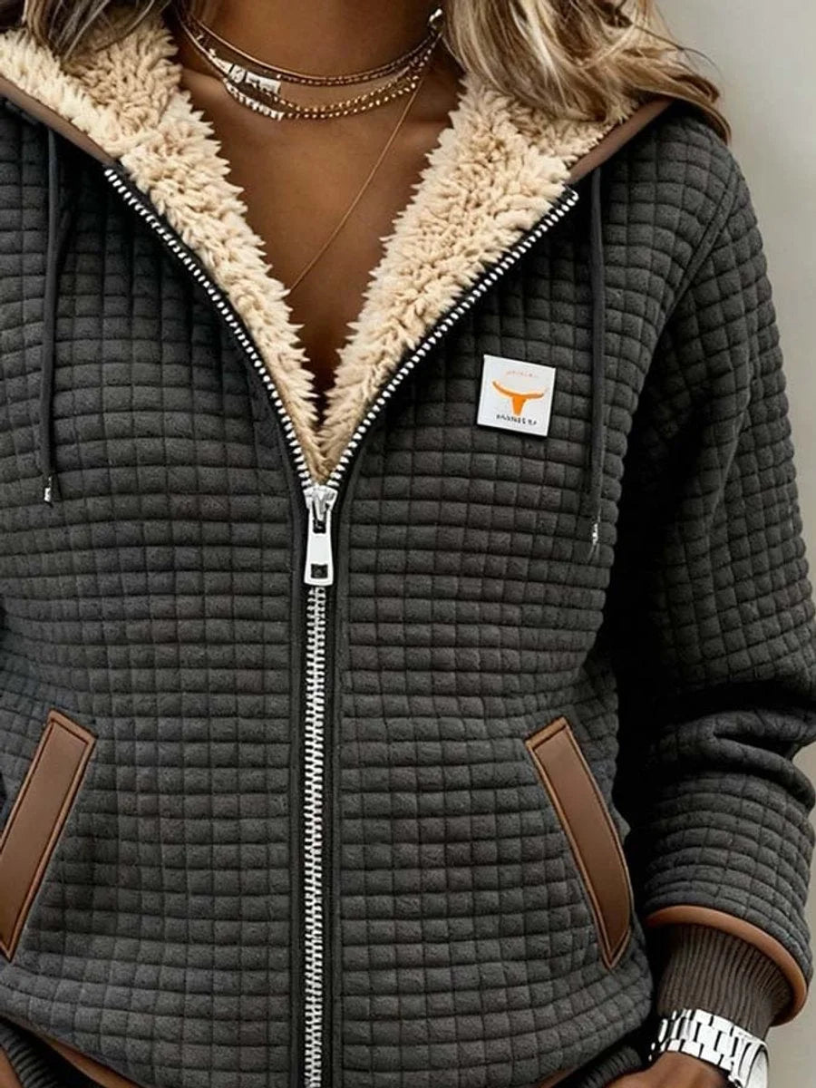 Detail view of hood with sherpa lining, zip and logo patch