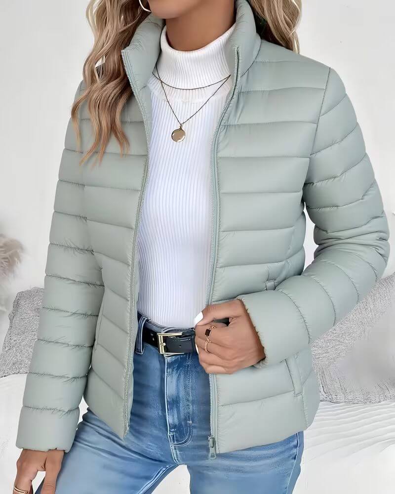 Front view showing stand collar, full zip closure and side pockets, green
