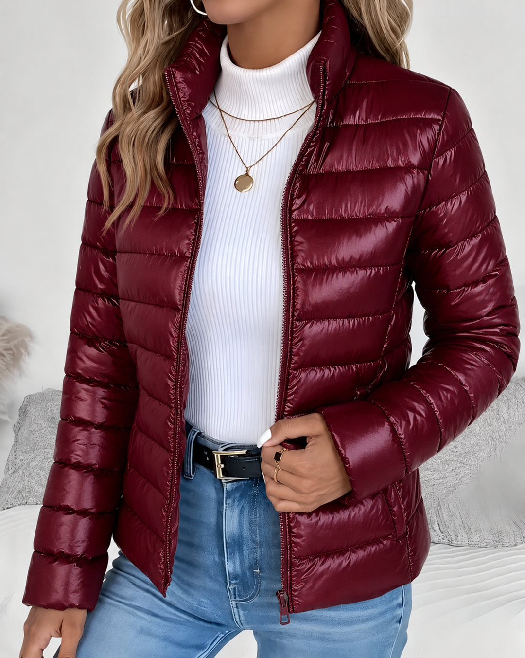 Front view showing stand collar, zip closure and quilted body, red