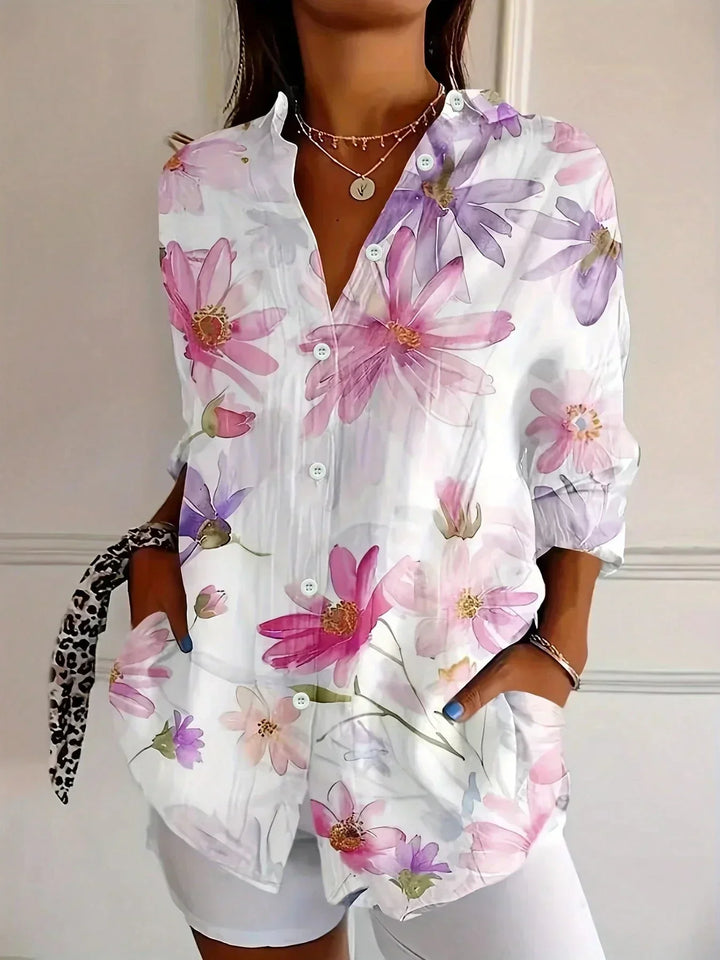 Front view showing v-neckline, button placket and side pockets, white